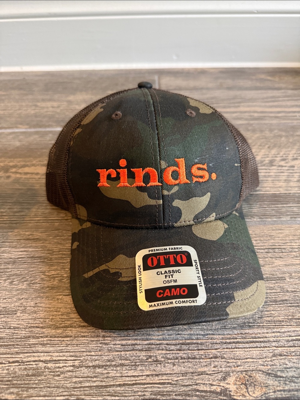 OTTO Camo Trucker Hat with Orange 'rinds.' Embroidery